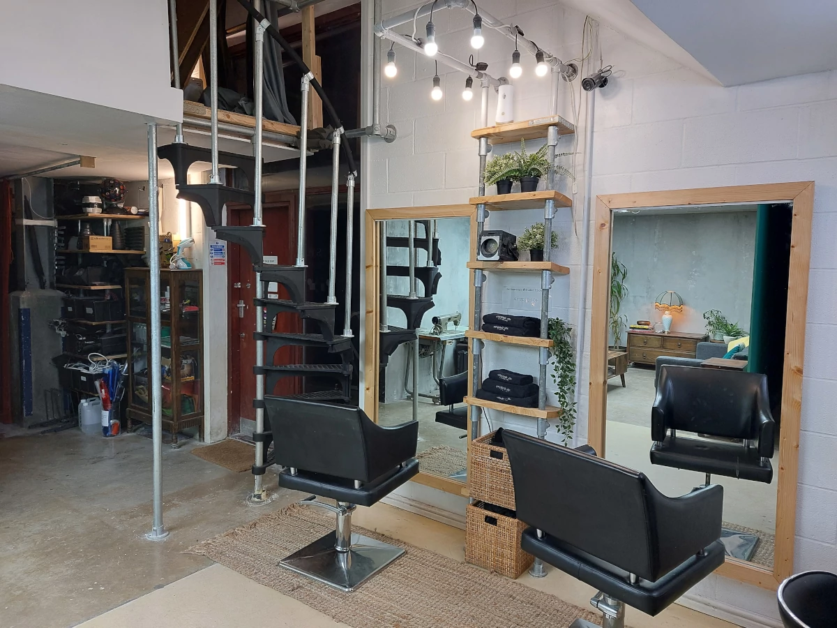hair salon and black spiral stair case 