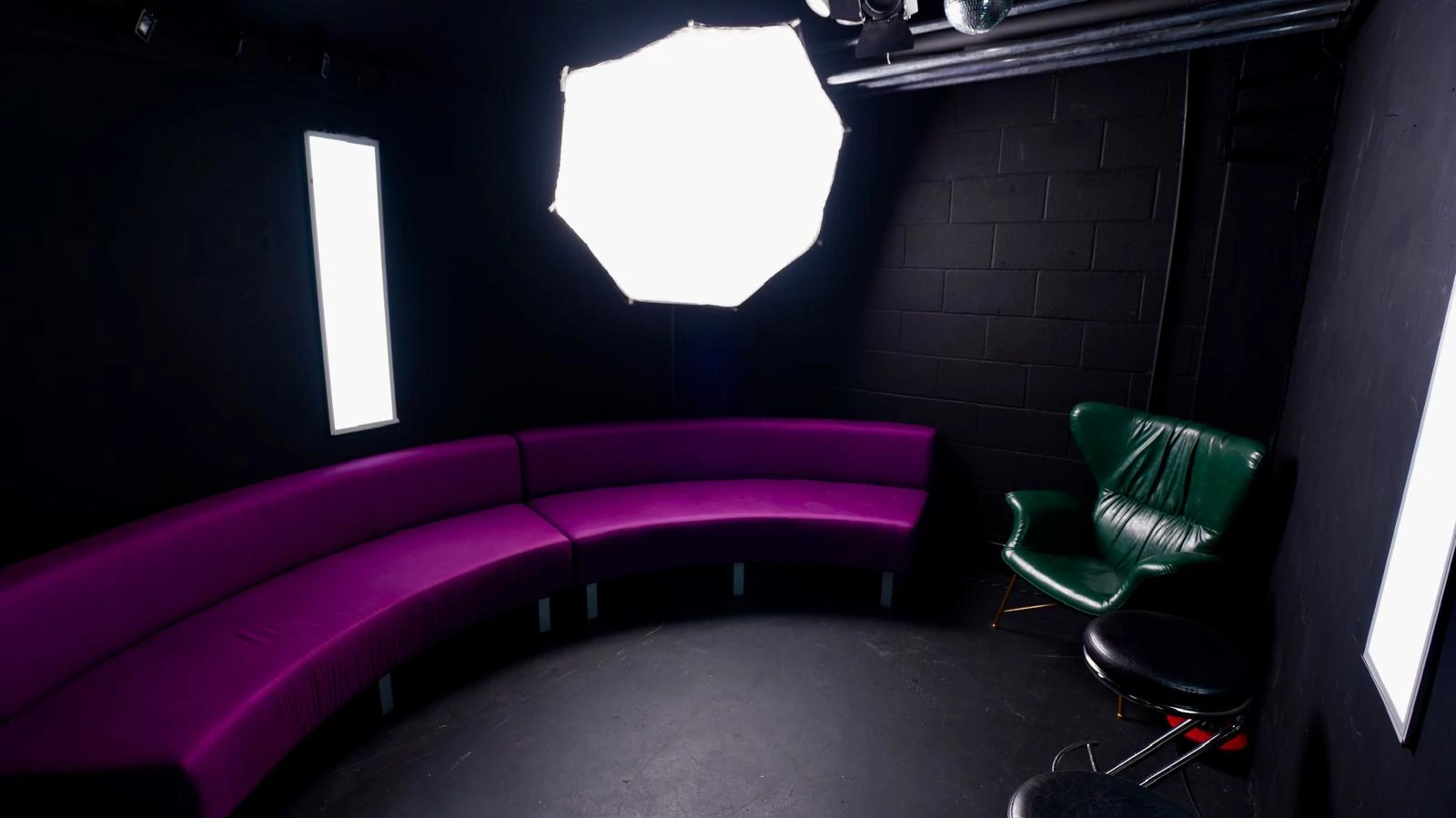 black studio purple curve sofa 